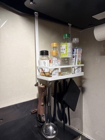 Yamazaki range hood spice rack installed above the stove
