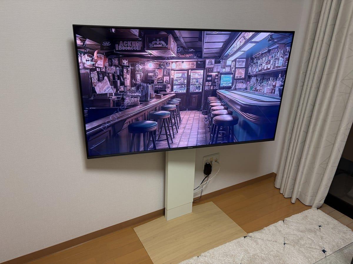 Hisense 55E7N on the WALL TV stand in our newlywed living room