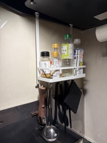 Yamazaki range hood spice rack installed above the stove